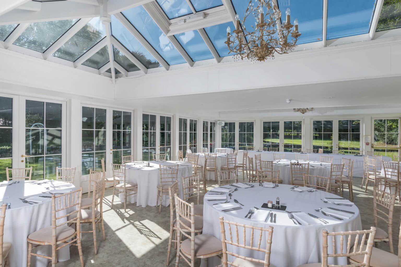 Bespoke conservatory for a restaurant or hotel, set for a wedding reception.