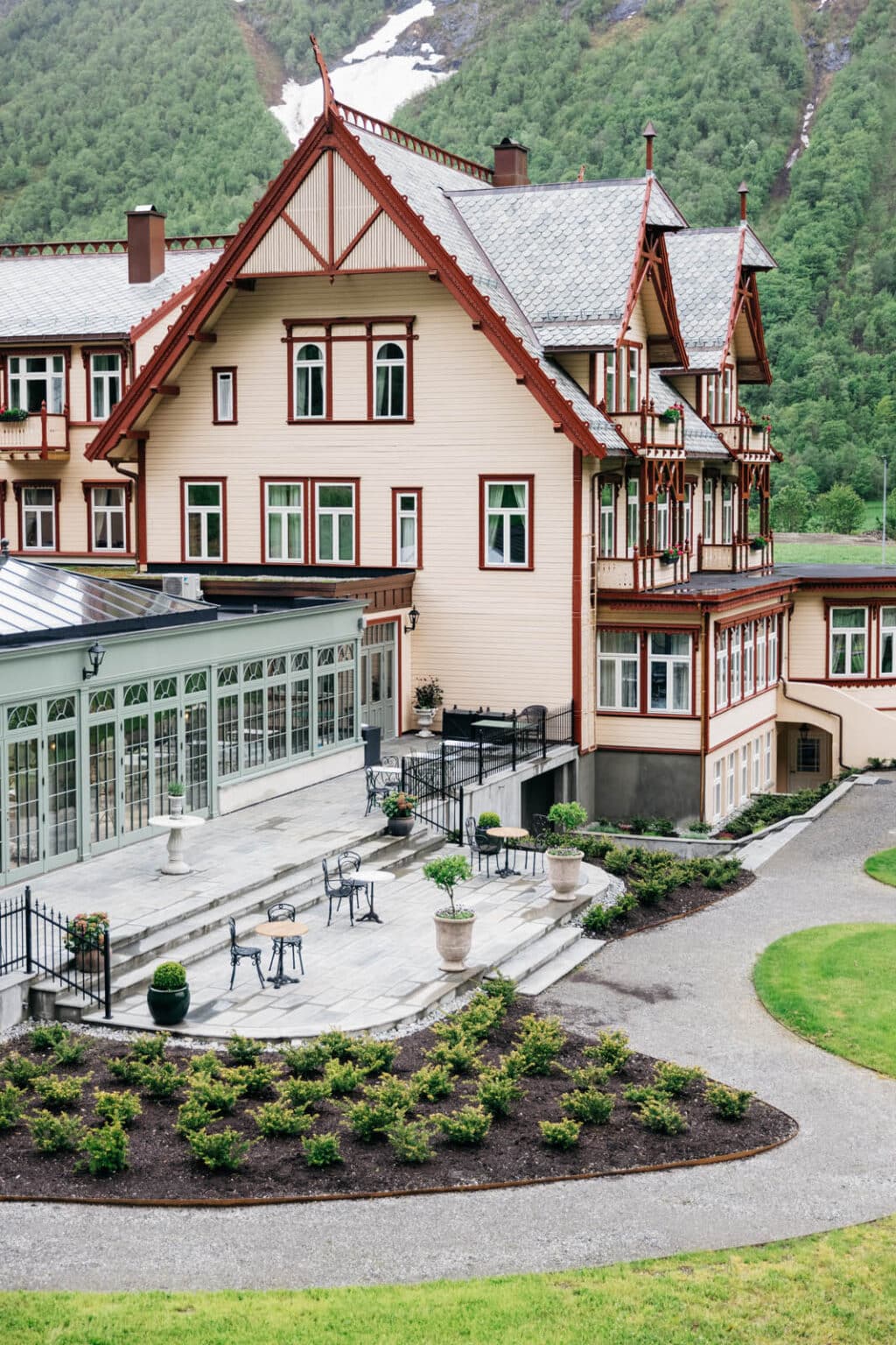 Hardwood conservatory extension on a commercial hotel, blending with the architecture.