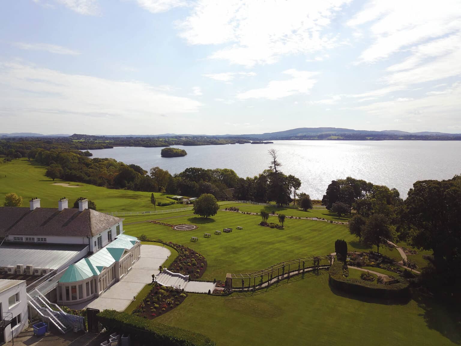 Commercial hotel and spa with a conservatory overlooking water.