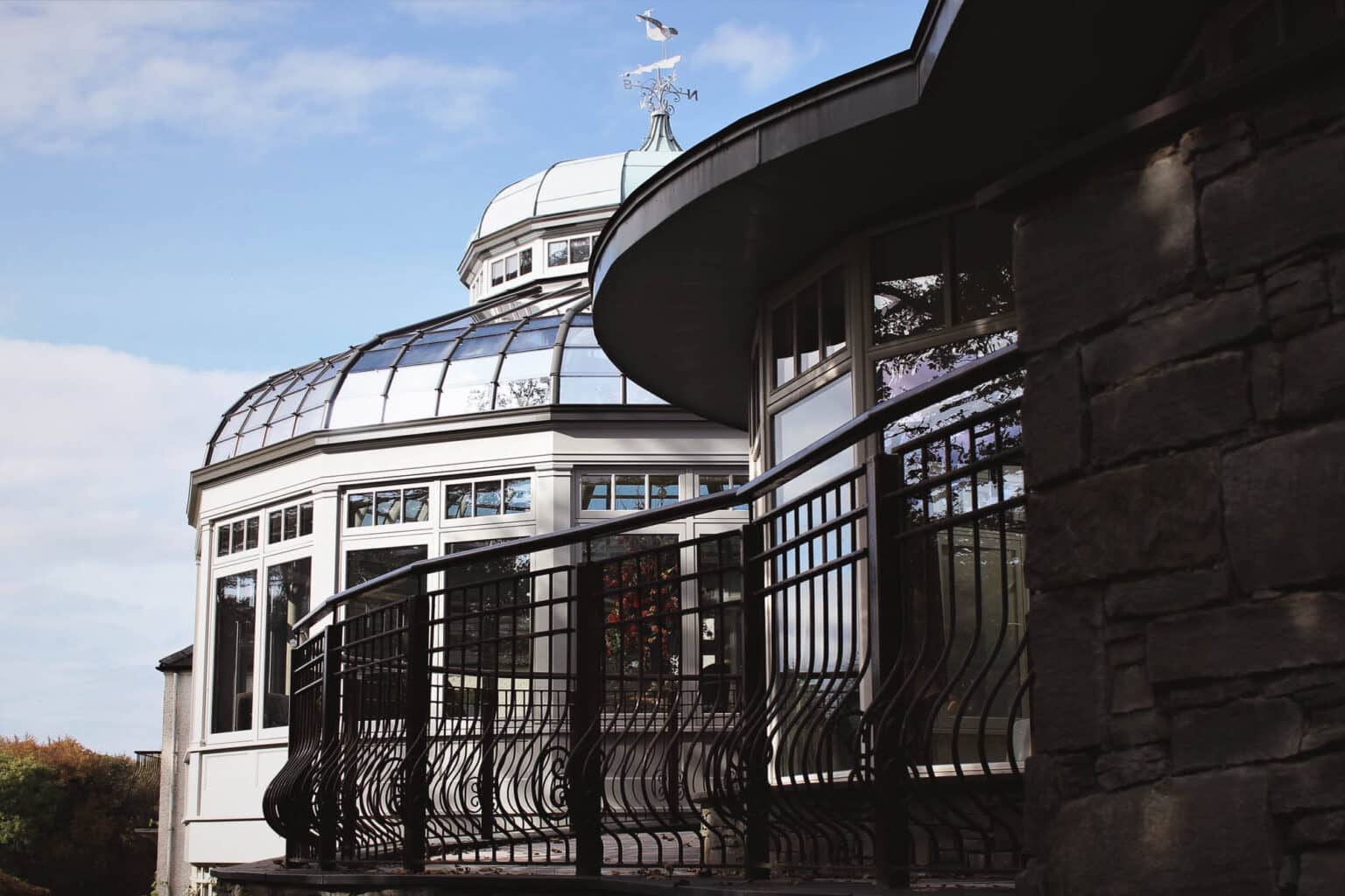 Bespoke curved glass conservatory on a commercial heritage building.