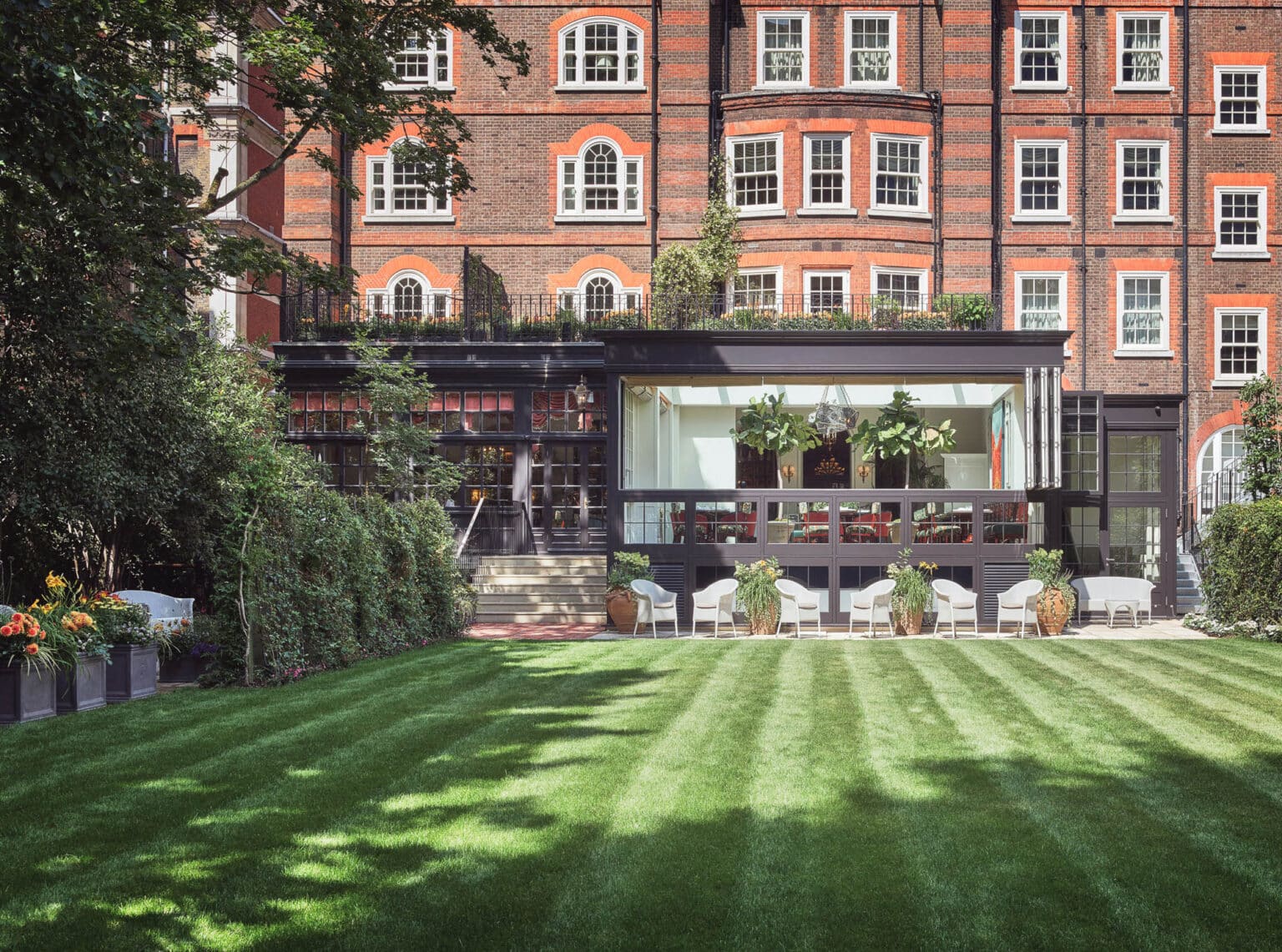 Illuminated glazed restaurant extension on a luxury hotel.